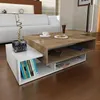 A modern living room with a white sofa and a wooden coffee table. Produktbild-Vorschau