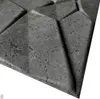 A close-up, angled view of a textured gray wall panel with geometric indentations. Produktbild-Vorschau