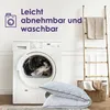 A washing machine and pillows are shown in a room with a ladder and laundry basket. Produktbild-Vorschau