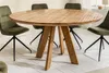 A round wooden dining table with four chairs around it, set in a dining room. Produktbild-Vorschau