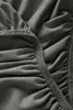 A close-up view of a grey fabric with elasticated edges, likely a fitted sheet. Produktbild-Vorschau