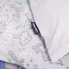 A close-up of a grey fabric with a repeating pattern of pixelated graphics, possibly from a video game. A black tag with the word "MINECRAFT" is visible on the right side, attached to a white fabric. Náhled obrázku produktu