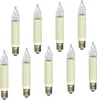 A collection of nine small candle-shaped light bulbs with cream-colored bases and clear glass tops, arranged in two rows against a white background. Produktbild-Vorschau