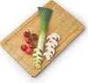 A bamboo cutting board with a leek, cherry tomatoes, and sliced mushrooms arranged on it. Náhled obrázku produktu