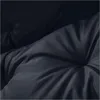 A close-up of a dark, tufted cushion, likely for outdoor furniture. Podgląd zdjęcia produktu