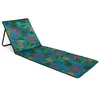 A beach mat with a tropical fruit and leaf pattern, laid out on a white background. Produktbild-Vorschau