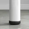 Close-up of the base of a white cylindrical object, likely a table leg, with a black adjustable foot on a tiled floor. Anteprima dell’immagine prodotto