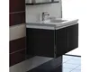 A bathroom vanity with a sink and faucet. Náhľad obrázku produktu
