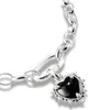 A close-up shot of a silver charm bracelet with a black heart-shaped charm adorned with small clear stones. Anteprima dell’immagine prodotto