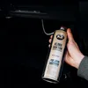 A hand holding a can of K2 Klima Doctor A/C cleaner inside a car. Anteprima dell’immagine prodotto