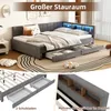 A corner bed with storage drawers and LED lighting, shown in a bedroom setting with decorative pillows and a rug. Produktbild-Vorschau