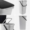 A collage of four images showing different views of a white plastic trash can with a black lid and handle. Produktbild-Vorschau