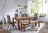 A dining room scene with a wooden table, chairs, and a bench. Náhľad obrázku produktu