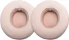 Two beige ear pads for headphones are shown against a white background. Náhled obrázku produktu