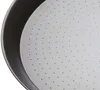 A close-up view of the interior of a perforated baking pan. Podgląd zdjęcia produktu