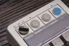 A close-up of a white 8bitdo Retro Numpad keyboard with various buttons and a screen. Produktbild-Vorschau