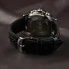 Close-up of the back of a black leather watch with a silver buckle. Produktbild-Vorschau
