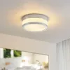 A ceiling lamp is mounted on a white ceiling. Produktbild-Vorschau