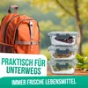 A backpack and stack of glass food containers are shown outdoors with a blurred natural background. Produktbild-Vorschau