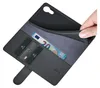 A hand is shown holding open a black leather wallet-style phone case, revealing credit cards and a 20 Euro banknote inside. Produktbild-Vorschau