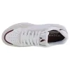 A top-down view of a white sneaker with red and beige accents. Anteprima dell’immagine prodotto