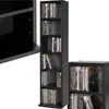 A black CD/DVD storage shelf unit filled with CDs and DVDs, shown from a slightly angled perspective. Produktbild-Vorschau