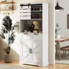 A white kitchen hutch with sliding barn doors and various kitchen items displayed on its shelves and countertop. A large potted plant is to the left, and a dining area is visible through an opening on the right. Podgląd zdjęcia produktu