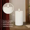A white LED candle with a flame is shown on a wooden surface, with a red curtain in the background. A close-up inset shows the top of the candle and its flame. Text overlays describe product features. Podgląd zdjęcia produktu