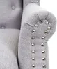 Close-up of the armrest of a gray armchair with decorative silver studs. Náhled obrázku produktu