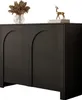 A black two-door cabinet with arched doors, decorated with a vase of dried flowers and a small golden deer figurine on top. Produktbild-Vorschau