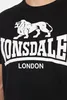 A close-up of a black t-shirt with a white Lonsdale logo and text. Produktbild-Vorschau
