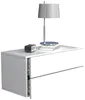 A white bedside table with a lamp and a small digital clock on top. Produktbild-Vorschau
