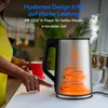 A person is holding a red mug next to a silver electric kettle. Produktbild-Vorschau