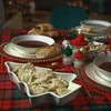 A festive table setting with food, likely for a holiday meal. Produktbild-Vorschau