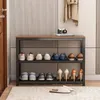 A shoe rack with shoes and slippers on it, placed in an entryway with a coat hanging on the wall. Produktbild-Vorschau