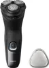 A black electric shaver and its protective cap are displayed against a white background. Podgląd zdjęcia produktu