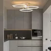A modern kitchen with sleek grey cabinets and a contemporary ring-shaped ceiling light. Podgląd zdjęcia produktu
