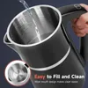 A person is filling a black electric kettle with water. The kettle has a stainless steel interior and a silver trim. There is text overlay on the image. Produktbild-Vorschau
