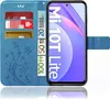 A blue flip case for a Xiaomi Mi 10T Lite phone, showing credit cards and euro banknotes inserted into the case. Produktbild-Vorschau