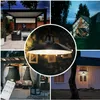 A collage of images showing outdoor lighting fixtures in various settings, including a patio, a small cabin, and a gazebo. The central image is a close-up of a pendant light. Produktbild-Vorschau