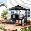 A backyard scene with a grill pavilion, grill, table, chairs, and people. Produktbild-Vorschau