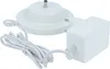 A white charging station and power adapter for a Toniebox. Produktbild-Vorschau