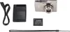 A Canon compact camera and its accessories are laid out on a white background. Produktbild-Vorschau