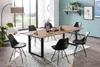 A dining room with a wooden table and chairs. Produktbild-Vorschau