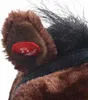 A close-up view of a plush toy horse's ear with a red button on it. Náhľad obrázku produktu