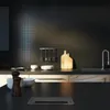 A modern kitchen counter with a built-in power outlet. Produktbild-Vorschau