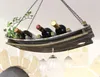 A hanging wine rack made of wood, designed to hold wine bottles and wine glasses, suspended from the ceiling. Produktbild-Vorschau