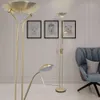 A modern living room scene with two floor lamps and a chair. Anteprima dell’immagine prodotto