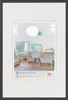 A framed picture of a room interior with a desk and chair. Anteprima dell’immagine prodotto