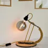 A desk lamp with a decorative Edison-style bulb. Produktbild-Vorschau